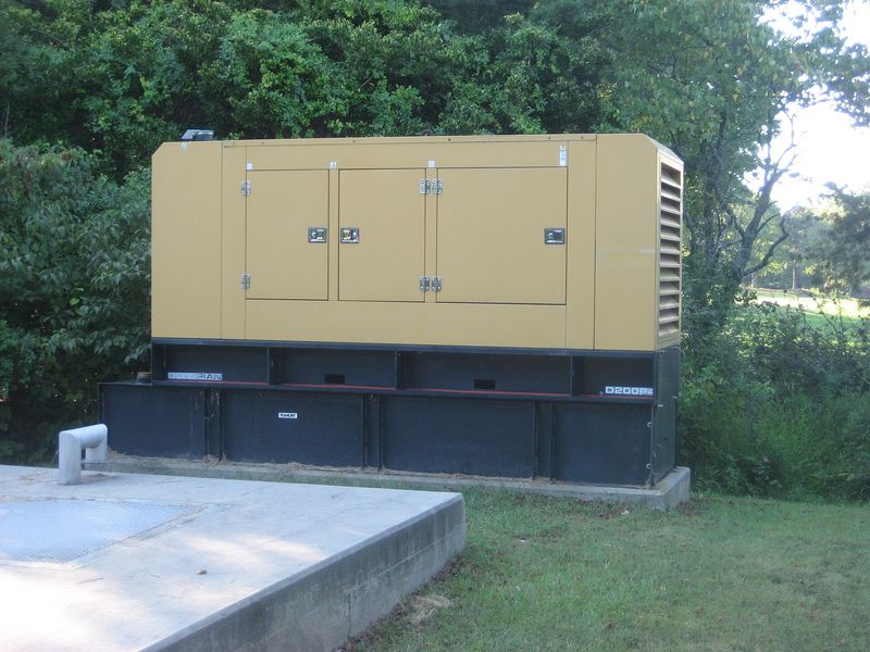 Enclosed standby diesel generator set on a concrete pad